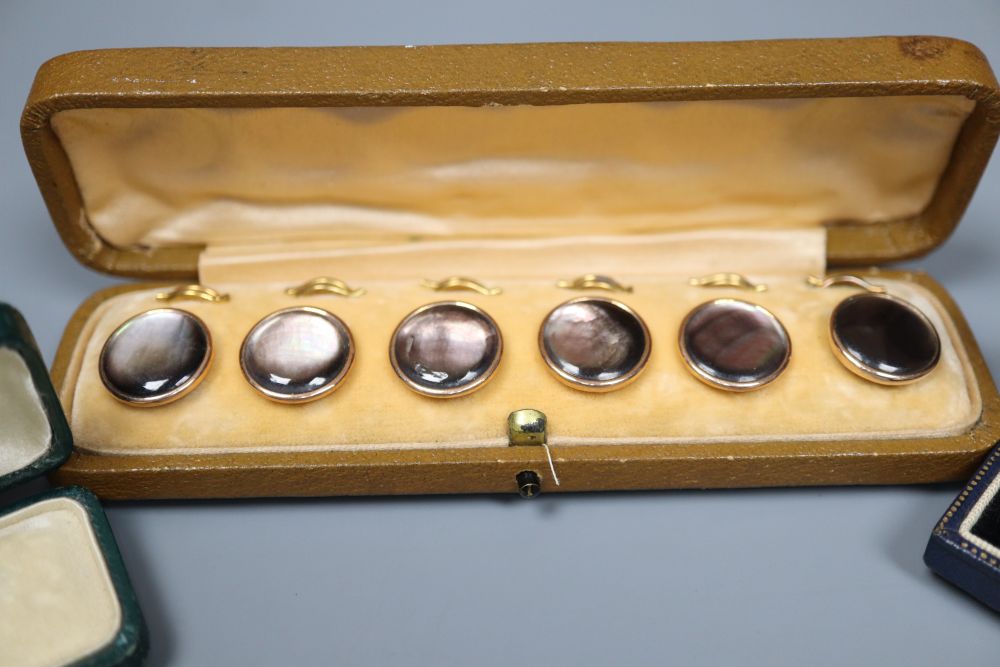 Six 9ct dress studs in two cases and one other cased set of six dress studs,